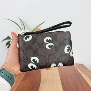 Coach Black and White Wristlet with Eye Design